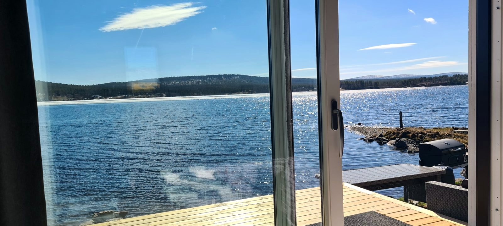 View from the riverside cottage over the water in Jukkasjärvi