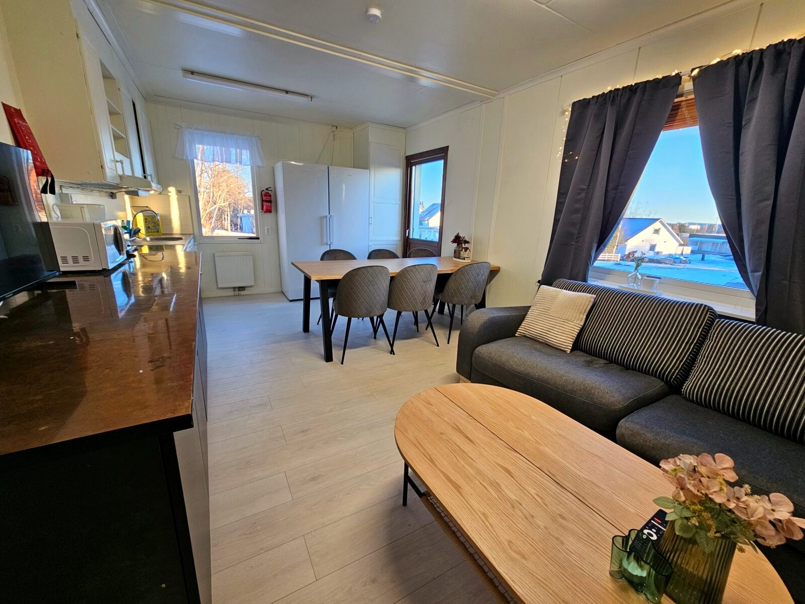 Open-plan furnished kitchen and living area in corporate housing in Kiruna